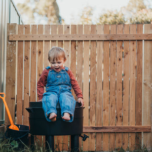 young boy sitting on a can-o-worms