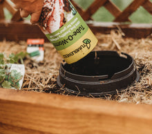 adding a tube of worm inside a worm buffet bucket 